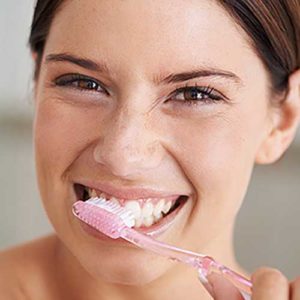 Woman brushing her teeth